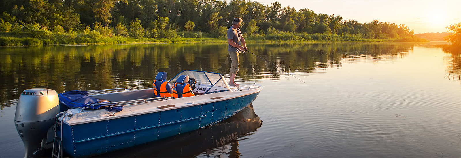 man standing on boat