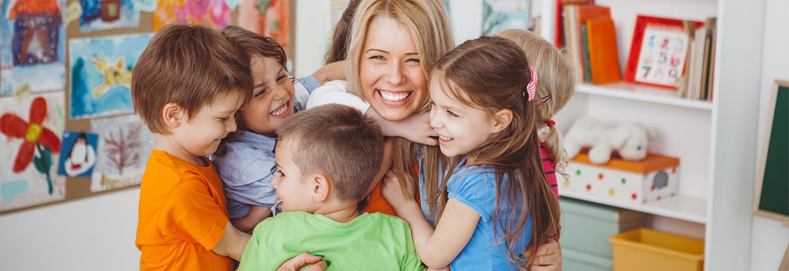 Children playing with childcare provider