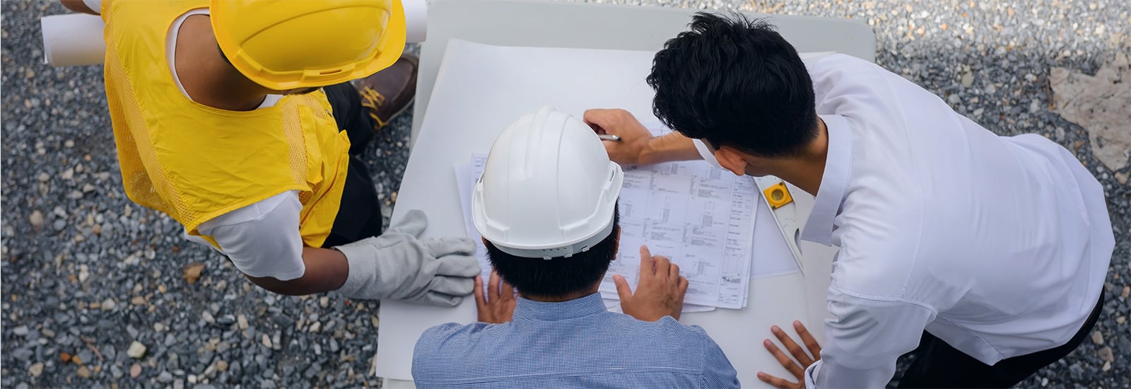 Constructions workers looking at a paper