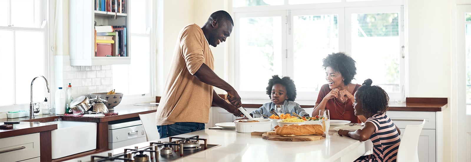 family sitting at kitchen table